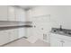 Laundry room with white cabinets and granite countertop at 1698 Cultivation Ln # 541, Mount Pleasant, SC 29466