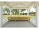 Interior of a white gazebo with wooden table and benches at 1698 Cultivation Ln # 541, Mount Pleasant, SC 29466