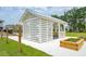 White gazebo with metal roof and wooden planters at 1698 Cultivation Ln # 541, Mount Pleasant, SC 29466