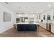Modern kitchen with white cabinets, island, and quartz countertops at 1698 Cultivation Ln # 541, Mount Pleasant, SC 29466