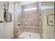 Large walk-in shower with a built-in seat and neutral tile at 119 Ashley Cove Way, Summerville, SC 29483