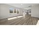 Sunlit living room with hardwood floors and kitchen view at 119 Ashley Cove Way, Summerville, SC 29483