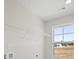Laundry room with window and overhead shelving at 119 Ashley Cove Way, Summerville, SC 29483