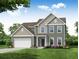 Two story house with gray siding, white garage door and landscaping at 119 Ashley Cove Way, Summerville, SC 29483