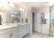 Double vanity bathroom with a large shower and grey tile floors at 119 Ashley Cove Way, Summerville, SC 29483