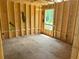 New home bedroom under construction, showcasing the framing and window at 119 Ashley Cove Way, Summerville, SC 29483