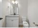 Clean powder room with granite countertop and white vanity at 119 Ashley Cove Way, Summerville, SC 29483