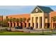 Wando High School exterior, brick building with palm trees and cars in parking lot at 3849 Delinger Dr, Mount Pleasant, SC 29466