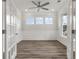 Bright office with hardwood floors, white walls, and three windows at 115 Ashley Cove Way, Summerville, SC 29483