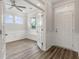 Home office with hardwood floors, white wainscoting, and French doors at 115 Ashley Cove Way, Summerville, SC 29483