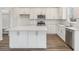 Modern kitchen with white cabinets, quartz countertops, and stainless steel appliances at 115 Ashley Cove Way, Summerville, SC 29483