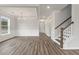 Spacious dining room with hardwood floors, chandelier, and white wainscoting at 115 Ashley Cove Way, Summerville, SC 29483