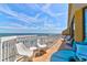 Spacious balcony with ocean views and comfortable seating at 201 W Arctic Ave # 421, Folly Beach, SC 29439