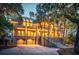 Two-story home with attached garage and palm trees at dusk at 3067 Marshgate Dr, Seabrook Island, SC 29455