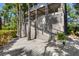 Exterior stairs leading to a deck, surrounded by lush landscaping at 3067 Marshgate Dr, Seabrook Island, SC 29455