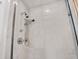 Clean shower with marble tile, handheld and rain shower heads at 3067 Marshgate Dr, Seabrook Island, SC 29455