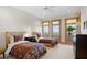Charming bedroom with two twin beds, water views, and natural light at 3067 Marshgate Dr, Seabrook Island, SC 29455