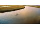 Two people kayaking in a marsh at 3067 Marshgate Dr, Seabrook Island, SC 29455