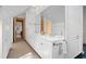 Double vanity bathroom with marble floors and ample storage at 3067 Marshgate Dr, Seabrook Island, SC 29455