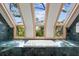 Spa-like bathroom with a large bathtub and skylights at 3067 Marshgate Dr, Seabrook Island, SC 29455