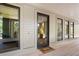 Modern glass front door and light beige exterior at 3067 Marshgate Dr, Seabrook Island, SC 29455
