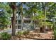 Two-story home with large windows and mature landscaping at 3067 Marshgate Dr, Seabrook Island, SC 29455