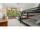 Bedroom with bunk beds, a hammock, and large windows at 3067 Marshgate Dr, Seabrook Island, SC 29455