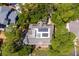Top-down view of a home with solar panels, surrounded by lush greenery at 3067 Marshgate Dr, Seabrook Island, SC 29455