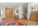 Bright landing with hardwood floors, a bench, and staircase at 3067 Marshgate Dr, Seabrook Island, SC 29455