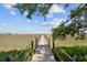 Wooden dock leading over marsh to water access at 3067 Marshgate Dr, Seabrook Island, SC 29455