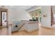 Open upper landing with hardwood floors and a piano at 3067 Marshgate Dr, Seabrook Island, SC 29455