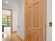 Light-filled hallway with hardwood floors and access to other rooms at 3067 Marshgate Dr, Seabrook Island, SC 29455