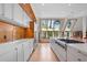 Bright kitchen with white cabinets and wood accents at 3067 Marshgate Dr, Seabrook Island, SC 29455