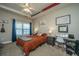 Bright bedroom with a comfortable bed, desk, and window at 1984 Folly Rd # B304, Charleston, SC 29412