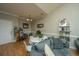 Cozy dining area with a round table, white chairs, and hardwood floors at 1984 Folly Rd # B304, Charleston, SC 29412