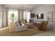 Cozy living room with sectional sofa, large windows, and built-in shelving at 618 Waterman St # 618, Charleston, SC 29492