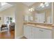 Elegant bathroom with double vanity and view of sitting area at 202 Needlerush Rd, Kiawah Island, SC 29455
