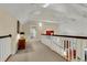 Spacious hallway with high ceilings and access to upper level at 202 Needlerush Rd, Kiawah Island, SC 29455