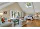 Large bedroom with sitting area and access to private deck at 202 Needlerush Rd, Kiawah Island, SC 29455