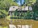 House exterior showcasing a waterfront view of a pond at 202 Needlerush Rd, Kiawah Island, SC 29455