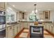 Kitchen with granite countertops, island, and stainless steel appliances at 202 Needlerush Rd, Kiawah Island, SC 29455