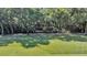 Luxury home nestled on a golf course with lush landscaping and water features at 202 Needlerush Rd, Kiawah Island, SC 29455