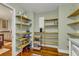 Walk-in pantry with ample shelving for food storage at 202 Needlerush Rd, Kiawah Island, SC 29455