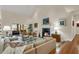 A sunlit living room with a fireplace and comfortable seating at 202 Needlerush Rd, Kiawah Island, SC 29455