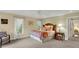 Well-lit bedroom with carpeted floor and large window at 202 Needlerush Rd, Kiawah Island, SC 29455