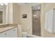 Small bathroom with shower, toilet and a vanity with granite countertop at 202 Needlerush Rd, Kiawah Island, SC 29455