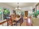Charming dining room with hardwood floors, a wooden table, and six chairs at 202 Needlerush Rd, Kiawah Island, SC 29455