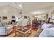 Open concept living and dining area with hardwood floors and ample natural light at 202 Needlerush Rd, Kiawah Island, SC 29455