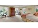 Bedroom with a wooden armoire, carpeted floor and large windows at 202 Needlerush Rd, Kiawah Island, SC 29455
