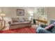 Cozy den featuring comfortable seating, a writing desk, and red carpet at 202 Needlerush Rd, Kiawah Island, SC 29455